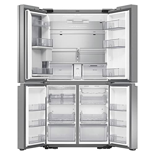 Open four-door refrigerator with empty shelves and drawers.